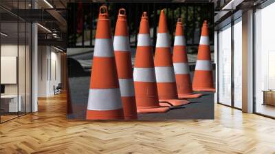 Perspective, orange traffic cones lined up side by side Wall mural