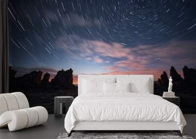 A man looking at the stars in the night sky timelapse Wall mural