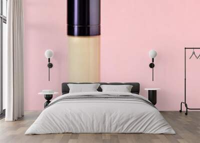 Concealer on pink background Wall mural