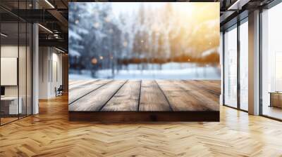 Empty dark wooden table and snow blurred background Wall mural