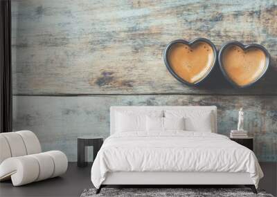 Two heart-shaped coffee cups filled with rich brew sit on a rustic wooden table, inviting warmth and a sense of togetherness Wall mural