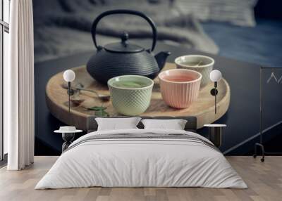 Black iron asian tea set on wooden tray Wall mural