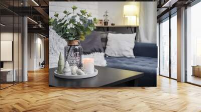 Christmas decorations with candle on coffee table Wall mural