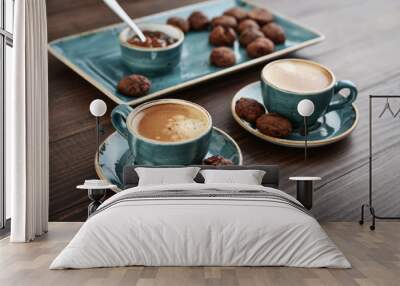 Two cup of coffee and with chocolate cookies Wall mural