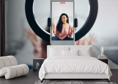 Live streaming, phone and black woman talking on video podcast in the bedroom of her house. Happy and excited girl or influencer speaking on the internet or social media with a mobile and ring light Wall mural