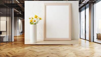 Frame mockup with white and yellow chamomiles in vase Wall mural