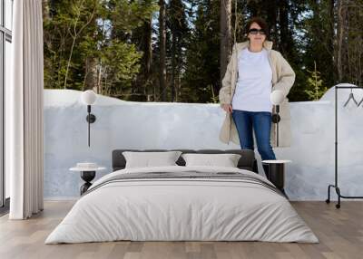 White sweatshirt mockup of a woman wearing black snow boots Wall mural