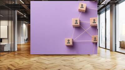 A visual metaphor for networking and team dynamics, featuring wooden blocks with human icons interconnected by lines on a purple backdrop. Wall mural