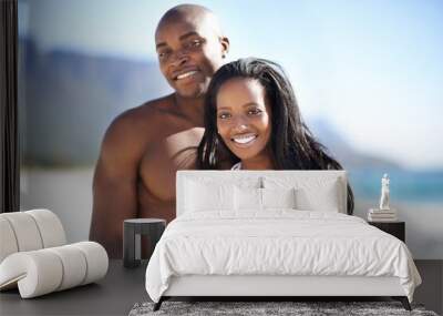 Happy, bonding and portrait of black couple at the beach for valentines day vacation, holiday or adventure. Smile, love and African man and woman on date by the ocean or sea on weekend trip together. Wall mural