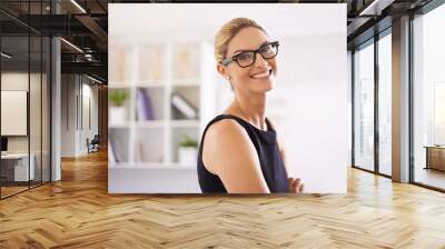 Living the dream. Portrait of an attractive woman standing in an office. Wall mural