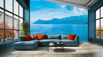 A beautiful blue ocean with a mountain in the background Wall mural