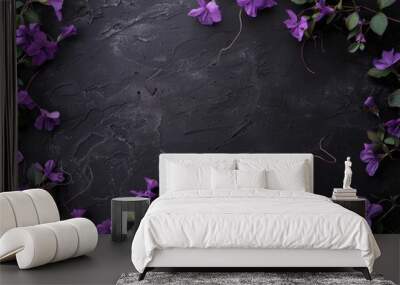 A black background with purple flowers in the foreground Wall mural