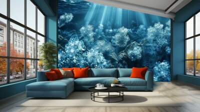 A blue ocean with a bunch of plants and rocks Wall mural