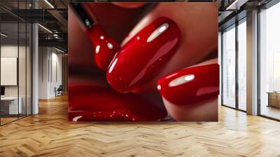 A woman's hand with red nails is shown on a wooden surface Wall mural