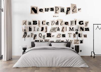 Alphabet in the style of anonymous messages. Letters cut out of a newspaper on a white sheet of paper. Wall mural