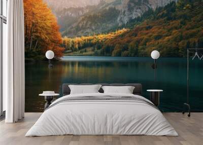 Autumn landscape of the smooth surface of a mountain lake, mountains and yellow trees on the shore. The concept for the development of tourism, mountaineering, skiing, rock climbing. Wall mural