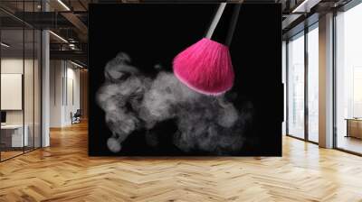 Burst of makeup powder with vibrant pink brush on dark background Wall mural