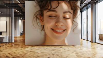 Close up portrait of young happy woman with closed eyes on blurred sunny background 
 Wall mural