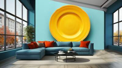 Empty yellow plate on blue background, intermittent fasting concept. Wall mural