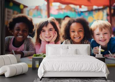 Happy and joyful children eating healthy food in the schoolyard. Back to school concept Wall mural