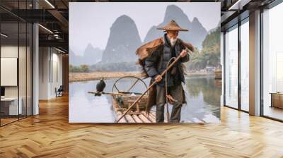 A traditional cormorant fisherman works on the Li River Yangshuo, China. Wall mural