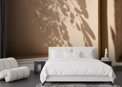 Minimalistic abstract gentle light beige background for product presentation with light andand intricate shadow from the window and vegetation on wall Wall mural