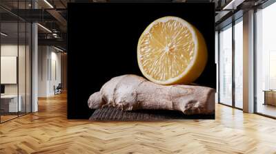 Lemon in a cut and ginger on a dark background. Wall mural