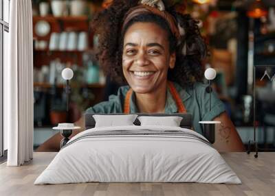 Portrait of happy adult african american female barista in cafe Wall mural