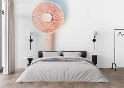 Small portable fan on white background close up, copy space. Wall mural