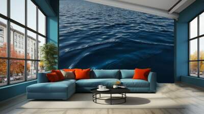 The lake's deep blue water glimmers, its surface disturbed by gentle ripples. Wall mural