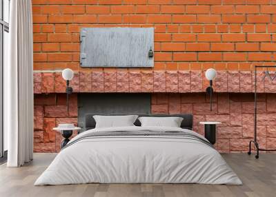 Two metal rectangular hatches in a red brick wall. Wall mural