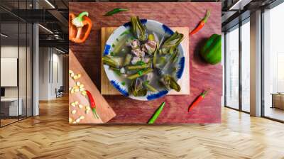 Vietnamese soup with fish and artichoke on wooden table Wall mural