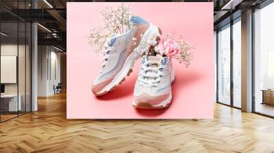 White sneakers with flowers on pink background, front view Wall mural