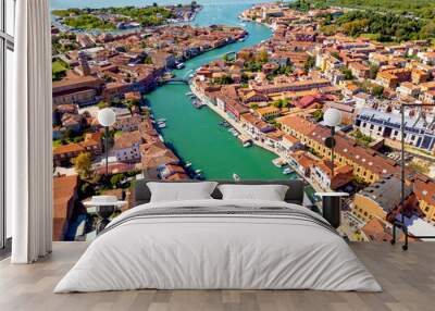 Panoramic view of the Murano island in Venetian lagoon from drone. Rooftops, canals and boats Wall mural