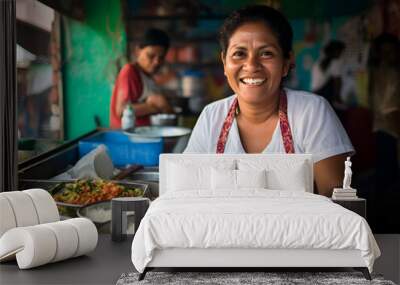 an hispanic happy and smiling woman making different mexican street food on a selling market Wall mural