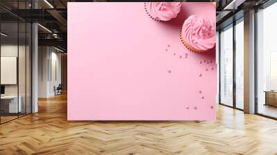 top view of cupcakes with pink buttercream frosting on pink background with copy space, ai generated Wall mural