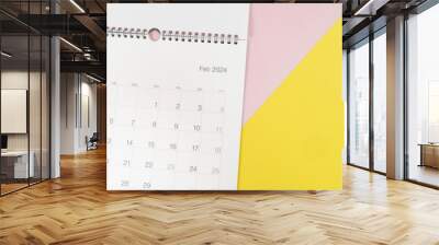 close up of calendar on the colorful pink and yellow table background, planning for business meeting or travel planning concept Wall mural