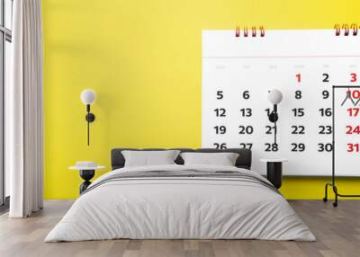 close up of calendar on yellow background, planning for business meeting or travel planning concept Wall mural