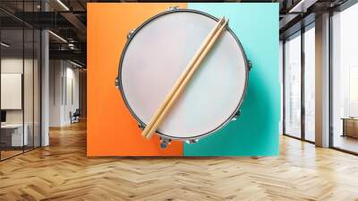 Drum stick on color table background, top view, music concept Wall mural