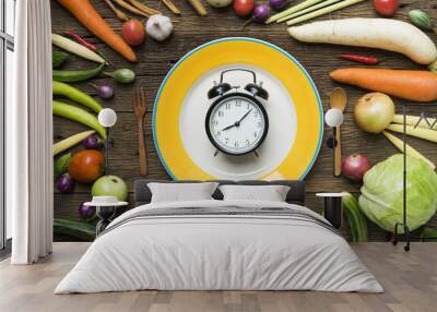 Food clock. Healthy food concept on wooden table Wall mural