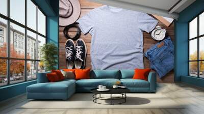 Mockup of a gray t-shirt blank shirt template with accessories on the table background, lifestyle and travel concept Wall mural