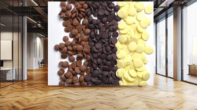 Close up of three types of couverture chocolate. Chocolate callets isolated on white. Wall mural