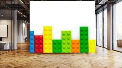 Colored toy bricks on white background Wall mural