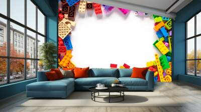 Colorful toy bricks frame with white empty space for your content Wall mural