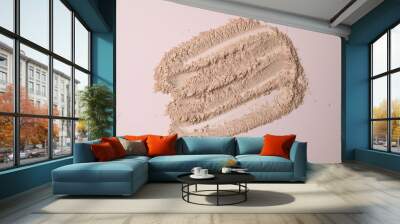 Loose cosmetic powder textured nude beige background. Make up surface. Background of cosmetic products strokes Wall mural