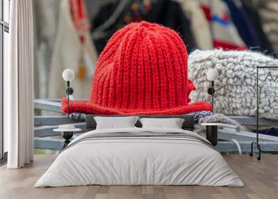 Colorful winter hats on market stall Wall mural