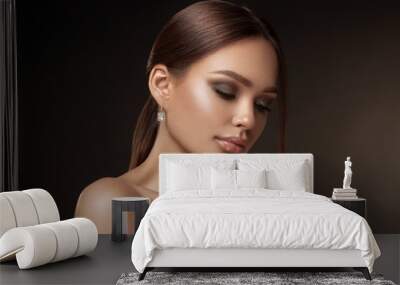 Beauty portrait of model with natural make-up. Fashion shiny highlighter on skin, sexy gloss lips make-up Wall mural