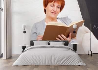 Adult woman reading book Wall mural