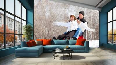 Mature couple sledding Wall mural