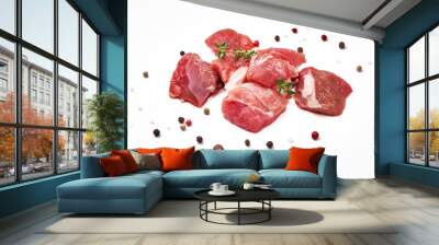 Sliced mutton meat with thyme herb and mix peppers isolated on white. Pieces of raw mutton meat. Wall mural